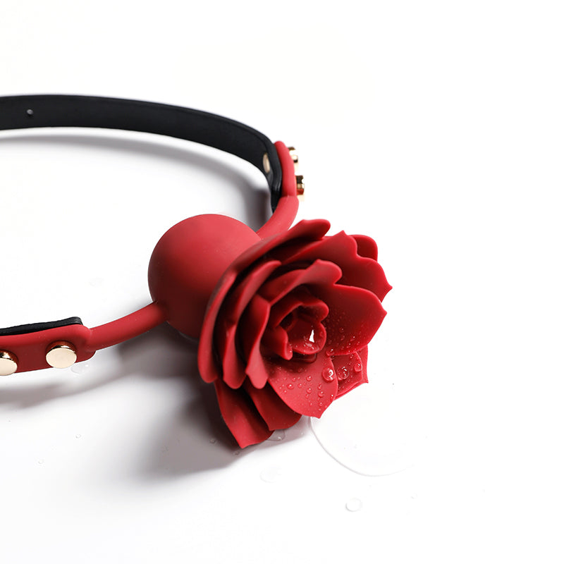 Close-up of breathable red silicone rose ball gag with adjustable vegan leather straps for aesthetic BDSM play by Sexy Maker.