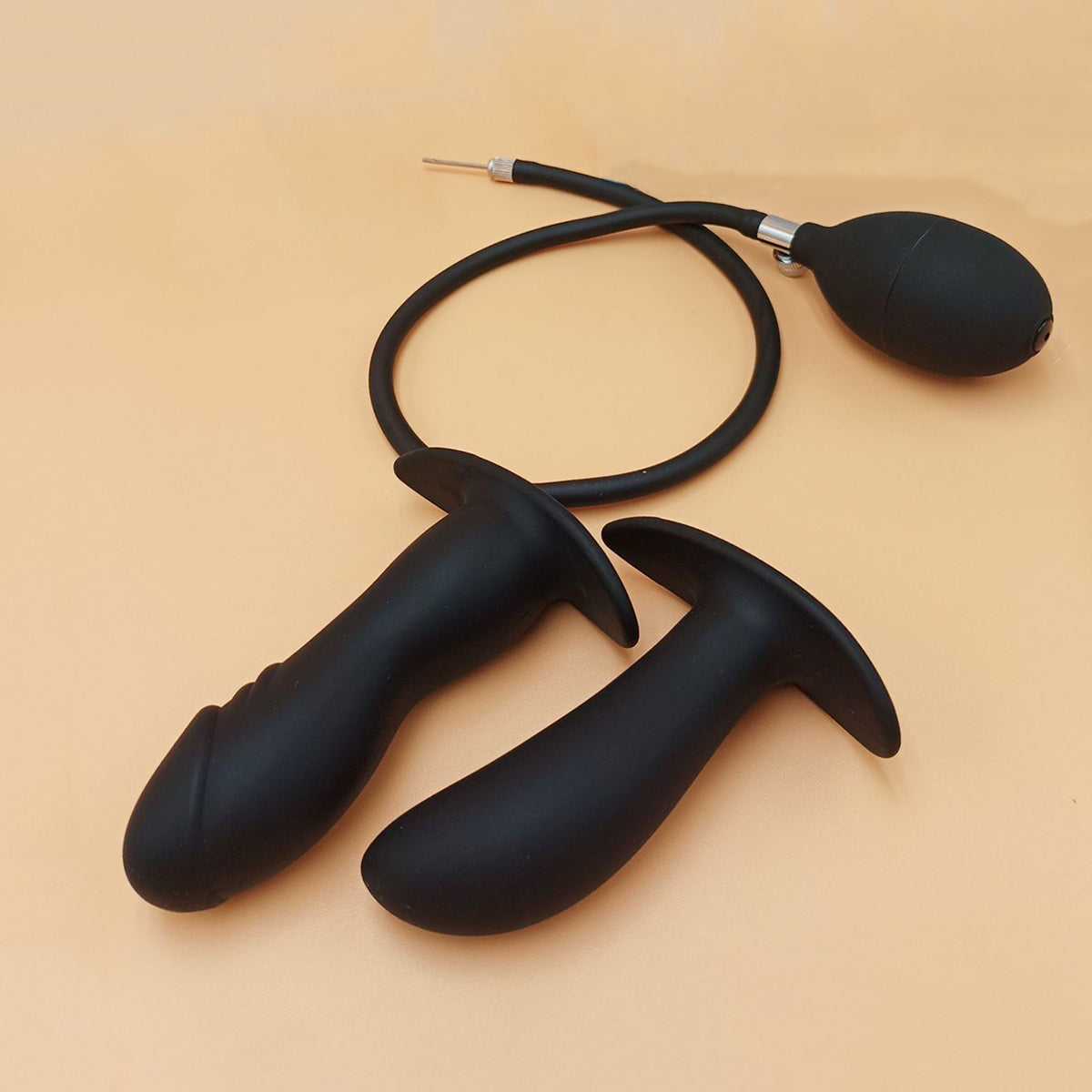 Black expandable inflatable silicone anal plug with detachable air pump for customizable stretching and public play by Sexy Maker.