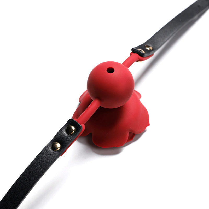 Close-up of breathable red silicone rose ball gag with adjustable vegan leather straps for aesthetic BDSM play by Sexy Maker.