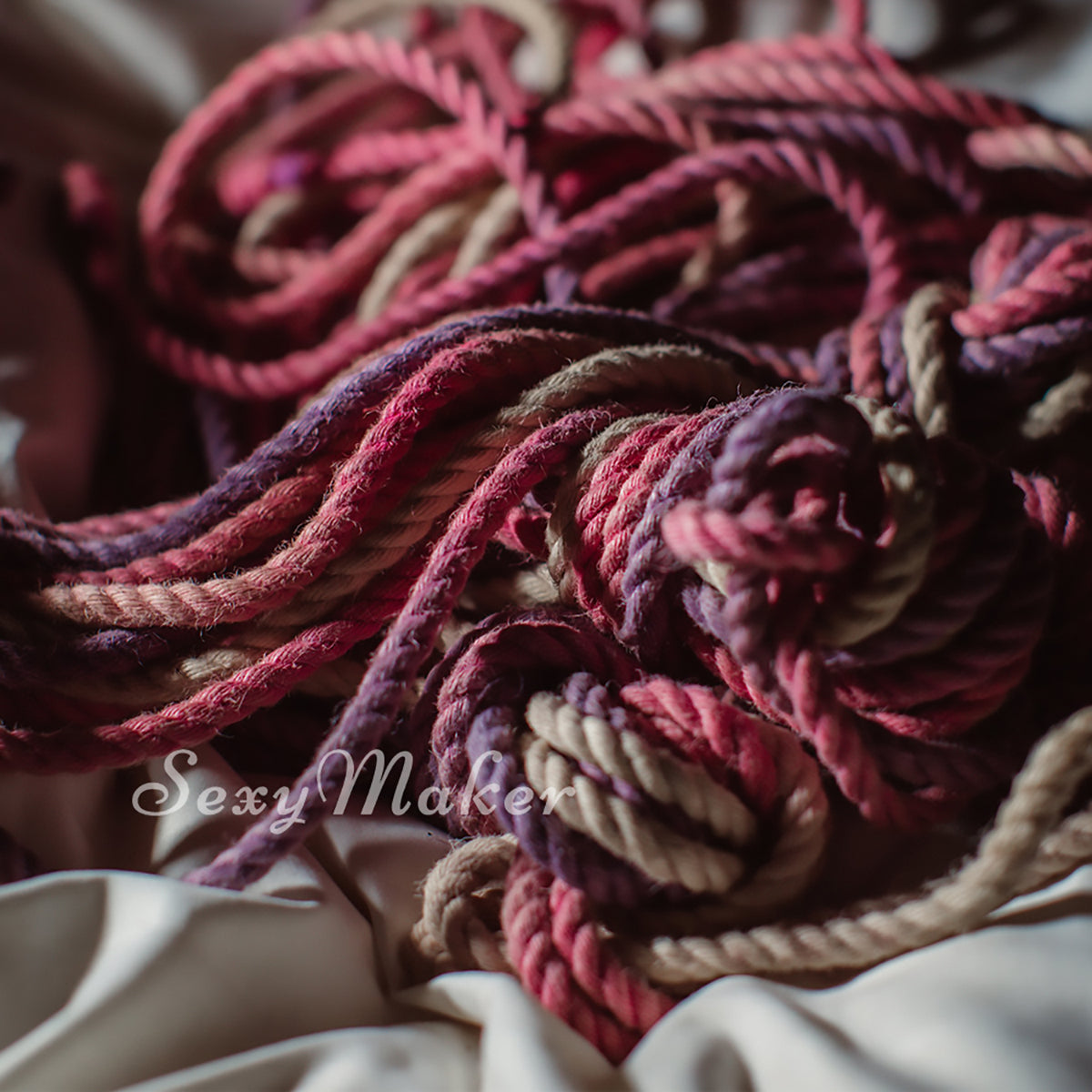 Purple pink jute Shibari rope used in chest harness bondage photography