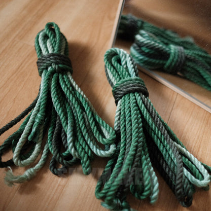 Close-up of premium treated 6mm jute Shibari rope in a dark to light green gradient for authentic Kinbaku and rope bondage by Sexy Maker.