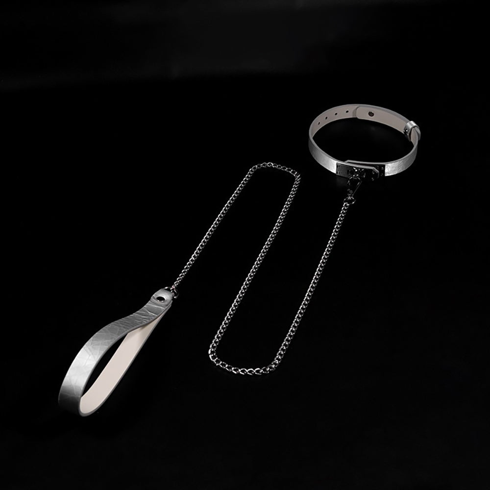 Close-up of premium cracked ice genuine leather BDSM collar featuring a minimalist metal lock plate and matching leash by Sexy Maker.