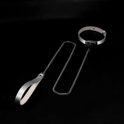 Close-up of premium cracked ice genuine leather BDSM collar featuring a minimalist metal lock plate and matching leash by Sexy Maker.