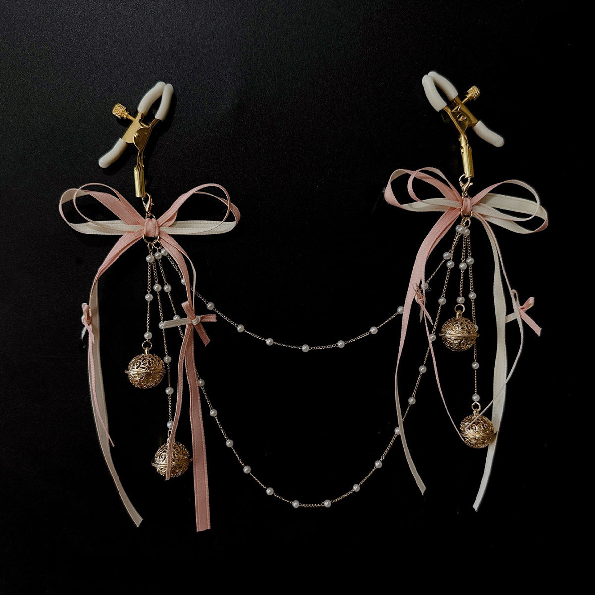BDSM Pearl chain nipple clips worn as boudoir jewellery aesthetic fetish accessory