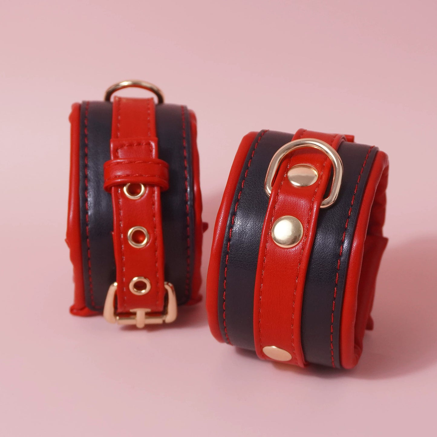 Close-up of the complete 7-piece premium vegan leather bondage starter set featuring padded cuffs, collar, and paw print paddle by Sexy Maker.