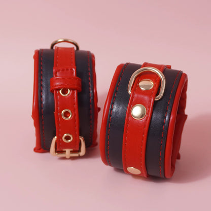 Close-up of the complete 7-piece premium vegan leather bondage starter set featuring padded cuffs, collar, and paw print paddle by Sexy Maker.