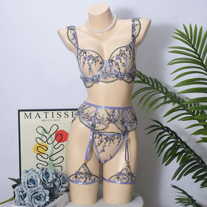 Front view of women's 3-piece lavender floral embroidery lace lingerie set featuring sheer mesh push-up bra and garter belt by Sexy Maker.