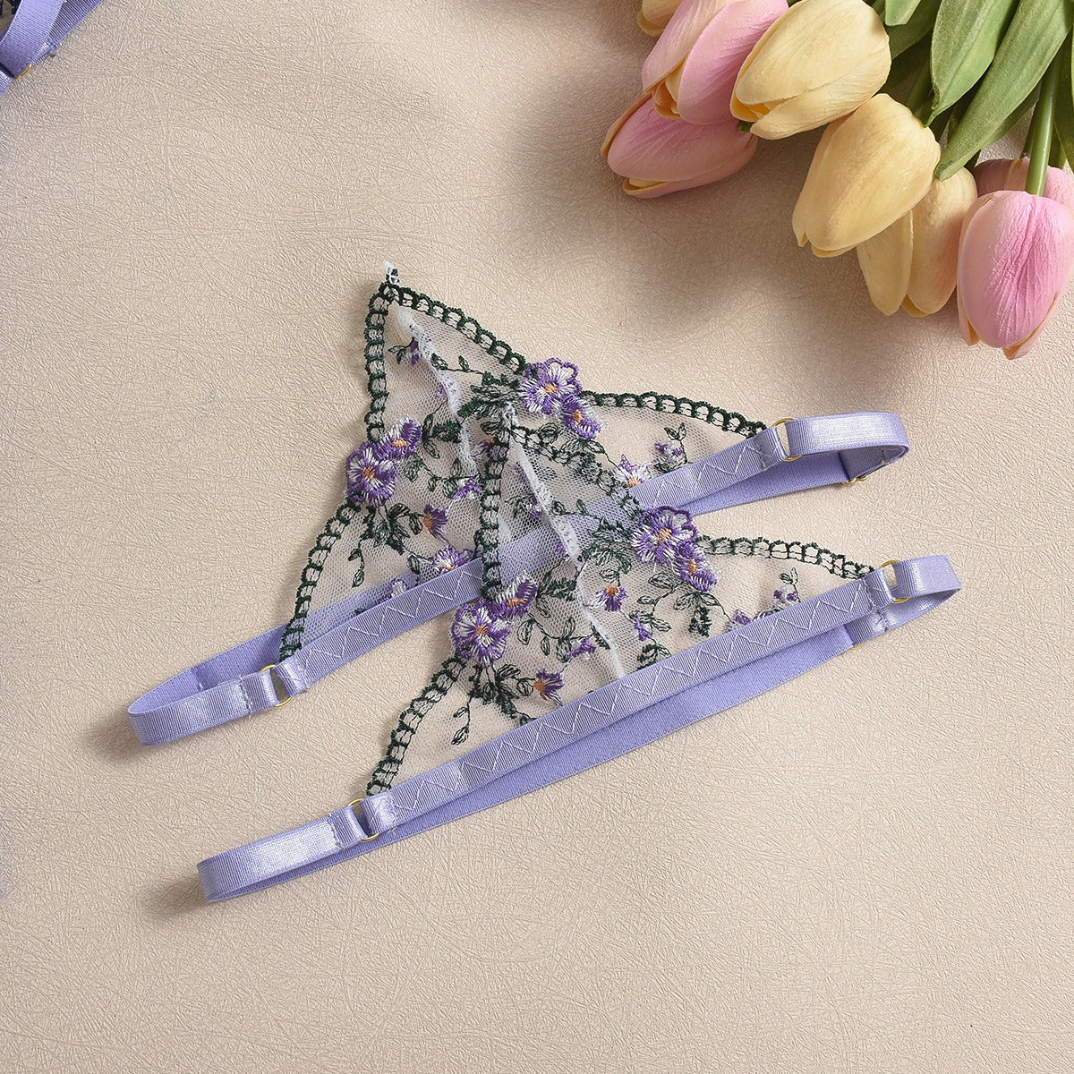 Front view of women's 3-piece lavender floral embroidery lace lingerie set featuring sheer mesh push-up bra and garter belt by Sexy Maker.