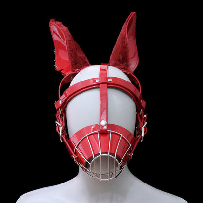 Close-up of glossy wet-look red human pup metal cage muzzle mask featuring feral fluffy faux fur ears and silver hardware for intense pet play by Sexy Maker.